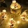 Kép 3/6 - LED fényfüzér gömbök mikulás figurás meleg fehér 3m-2